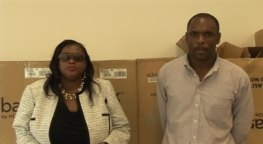 (L-R) Federal Central Purchasing Unit Representative Joycelyn Matthew-Martin and Treasurer in the Nevis Island Administration Colin Dore
